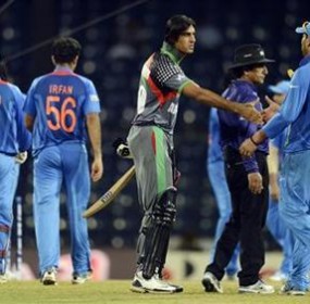 Afghanistan's Shapoor Zadran shakes hands with India's Yuvraj after India defeated his team in the ICC World Twenty20 group A match at the R Premadasa Stadium, Colombo