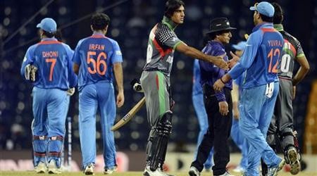 Afghanistan's Shapoor Zadran shakes hands with India's Yuvraj after India defeated his team in the ICC World Twenty20 group A match at the R Premadasa Stadium, Colombo