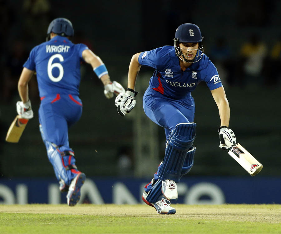 England's batsmen Alex Hales, right, and Luke Wright run between wickets