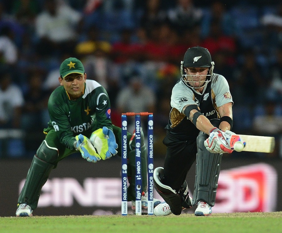 Brendon McCullum plays a shot as Pakistan wicket keeper Kamran Akmal 