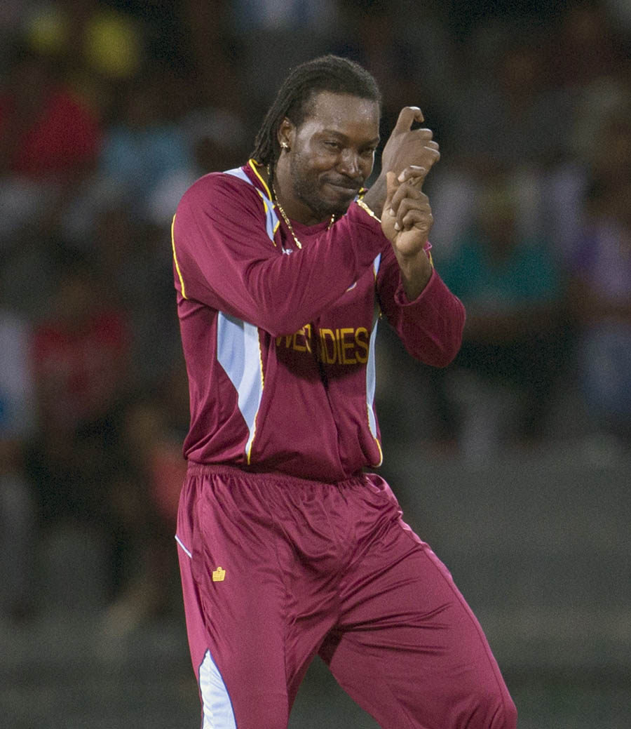 West Indies's Chris Gayle dancers after  dismissing Ireland's Gary Wilson