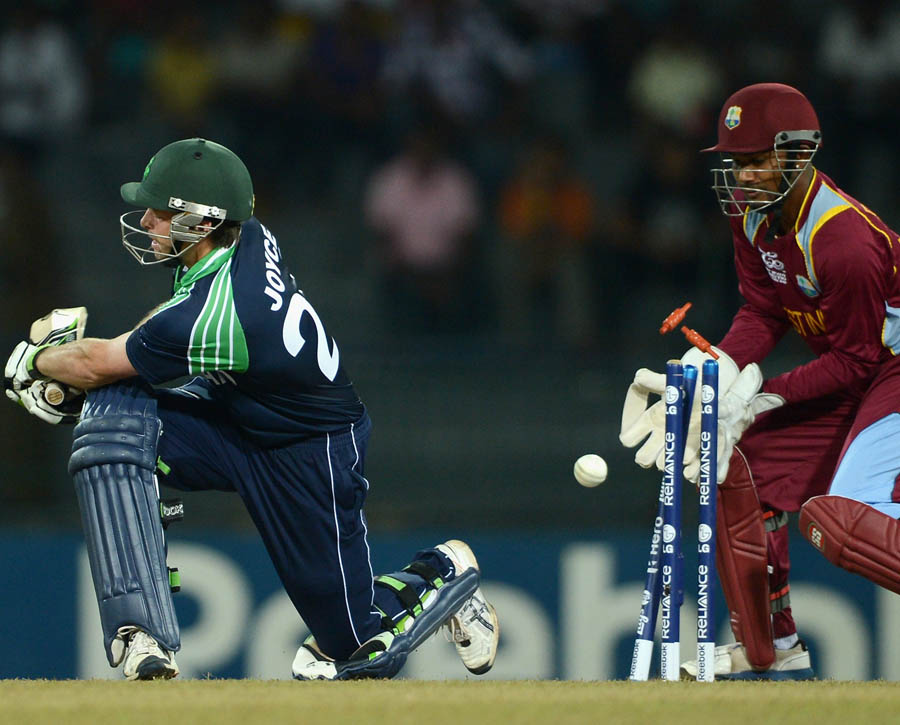 Ed Joyce of Ireland is bowled by Sunil Narine of the West Indies