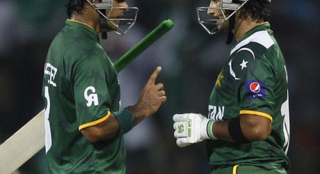 Pakistan's captain Mohammad Hafeez, left, talks to fellow batsman Imran Nazir