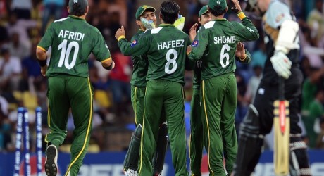Pakistan cricketers celebrate the run out of New Zealand batsman Kane Williamson
