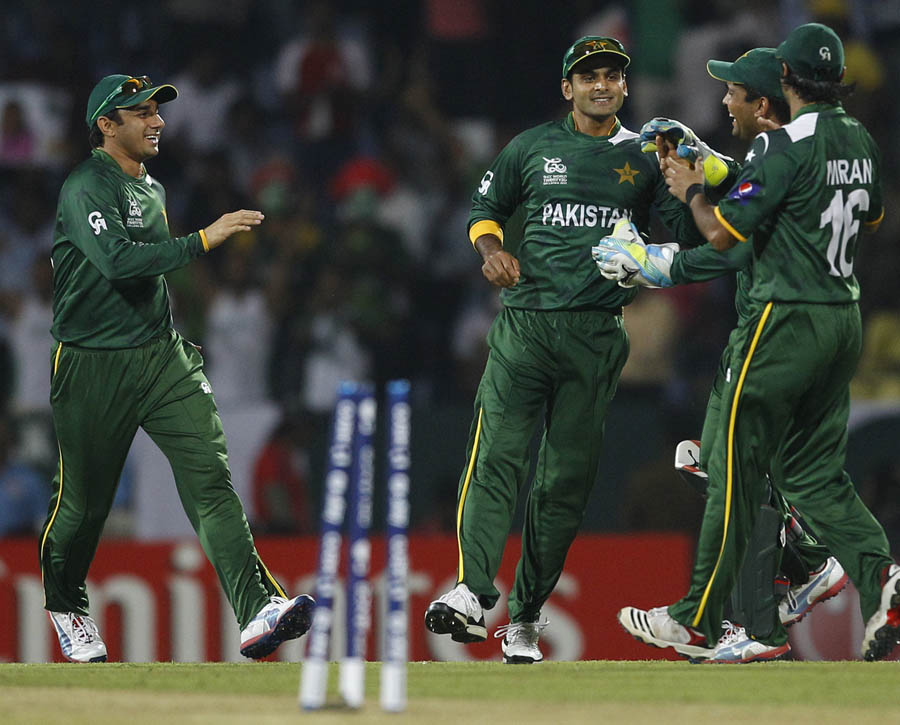 Mohammad Hafeez, second left, celebrates the run-out of Bangladesh batsman Tamim Iqbal