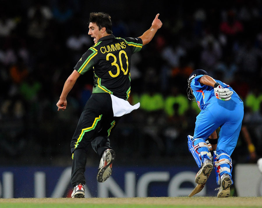 Pat Cummins kicks the ball onto the stumps to run out Gautam Gambhir