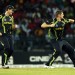 Shane Watson, right, celebrates the dismissal of West Indies' batsman Chris Gayle