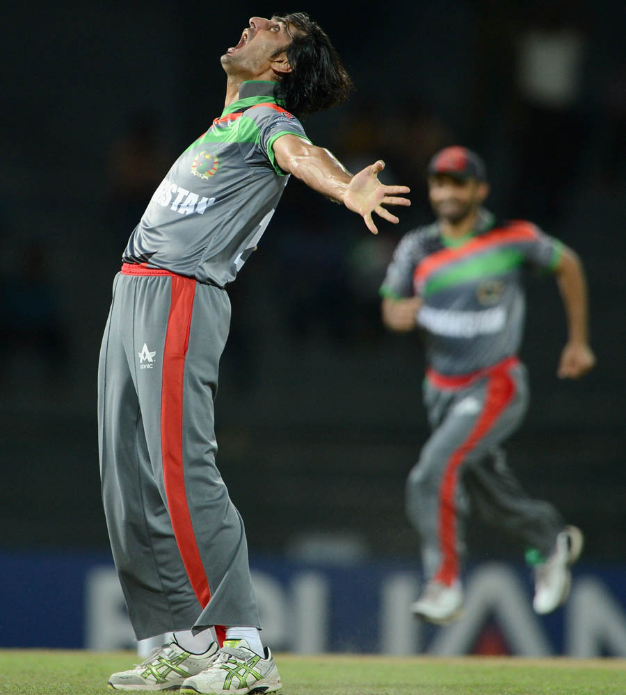 Shapoor Zadran of Afghanistan celebrates dismissing Craig Kieswetter of England