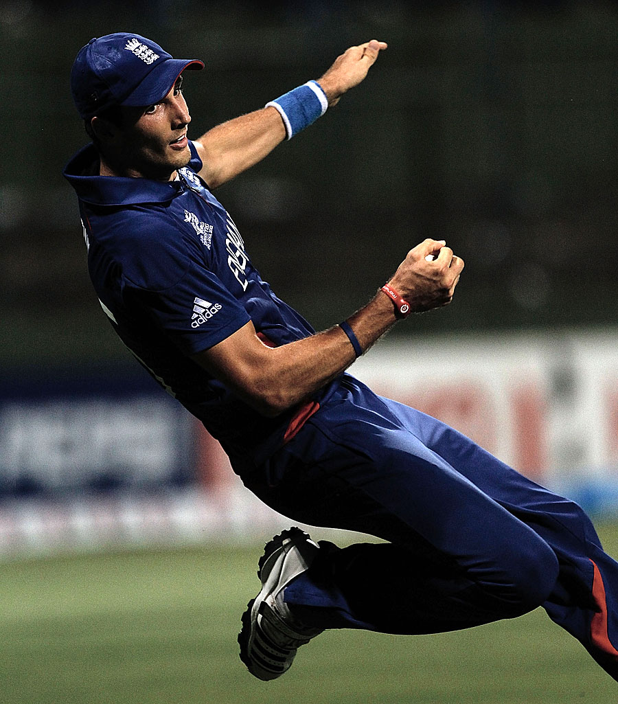 Steven Finn falls backwards as he catches Chris Gayle