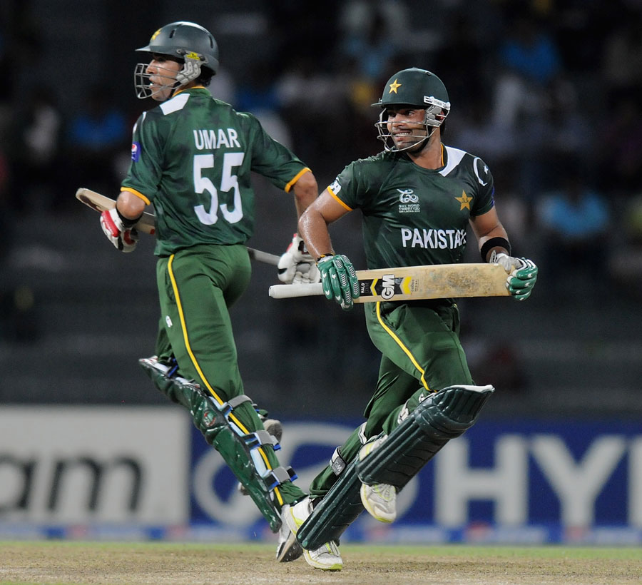 Umar Gul and Umar Akmal cross for a run, Pakistan v South Africa