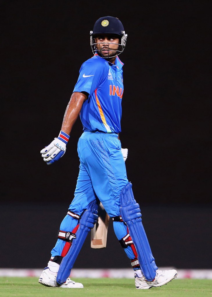 Virat Kohli walks off after making a 32-ball 40