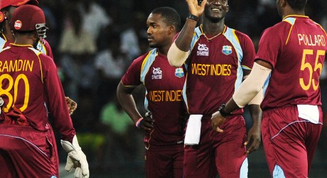 West Indies cricketer Darren Sammy (2R) celebrates after he dismissed Ireland cricketer Paul Stirling