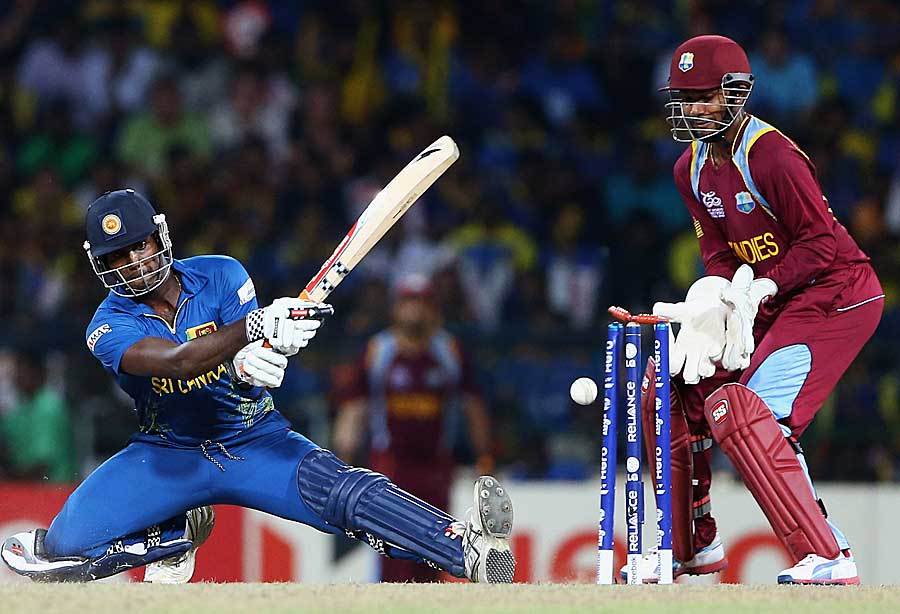 Angelo Mathews is bowled while trying to play the scoop