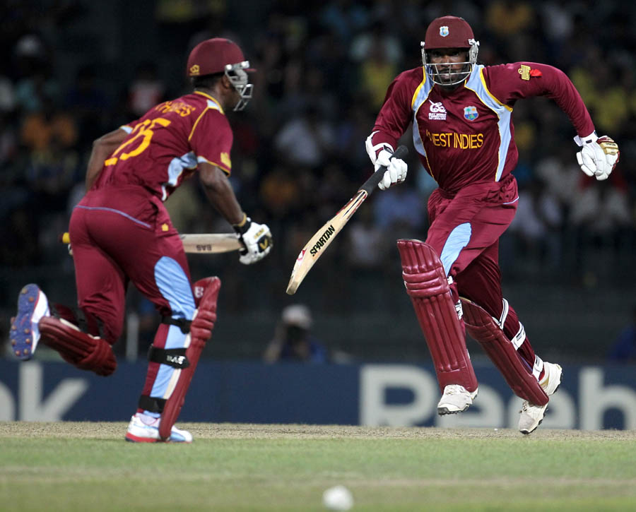 Chris Gayle (right) and Johnson Charles of West Indies running between wickets