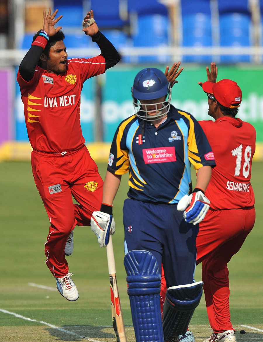 Dilshan Munaweera celebrates his second wicket in as many balls as he bowls Gary Ballance, Uva v Yorkshire
