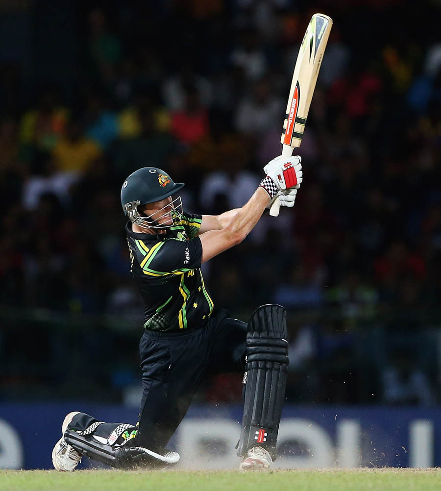 George Bailey of Australia hits a six, as Denesh Ramdin of the West Indies