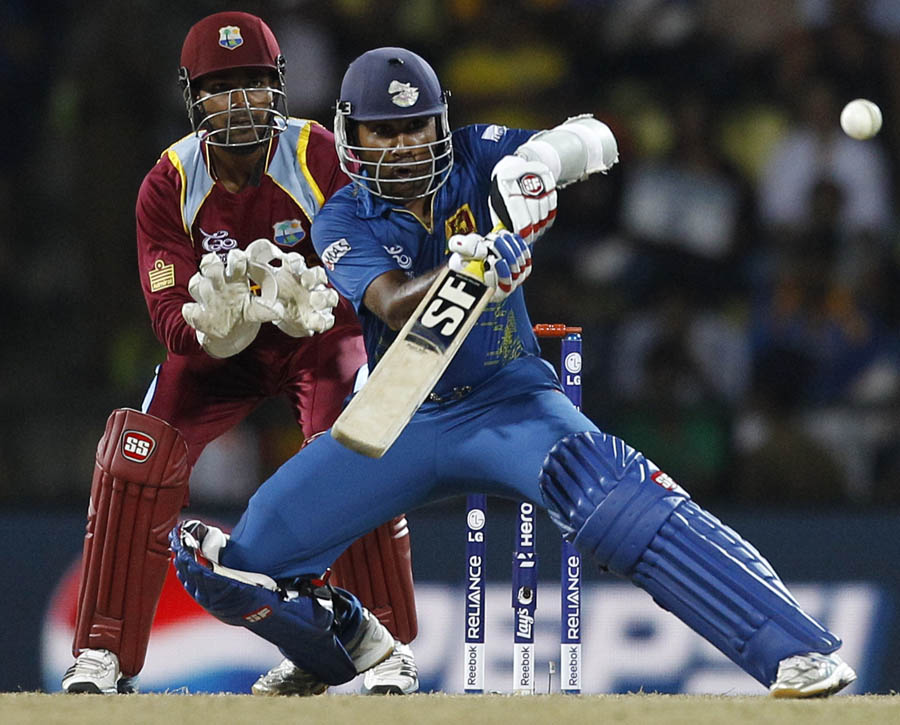 Sri Lanka's captain Mahela Jayawardene, right, plays a shot 