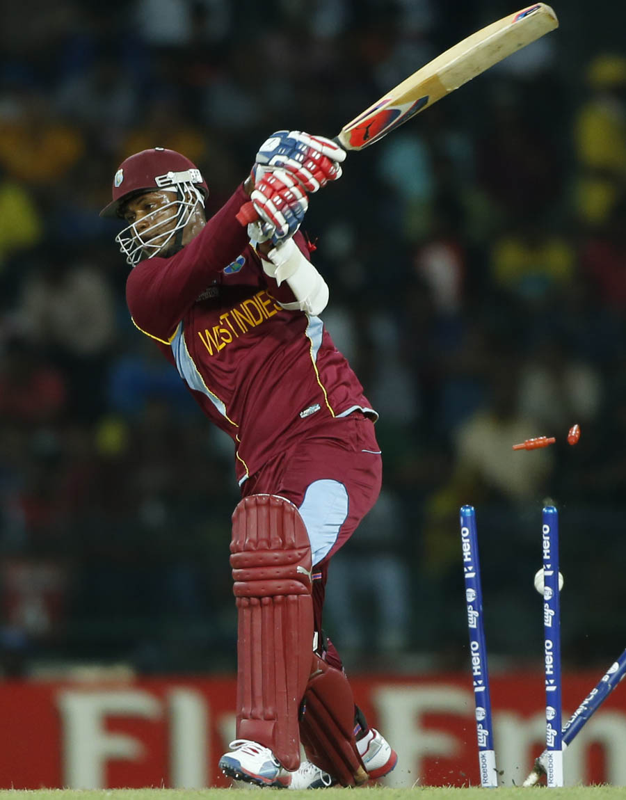 West Indies' batsman Marlon Samuels bowled out by Australia's Pat Cummins, unseen