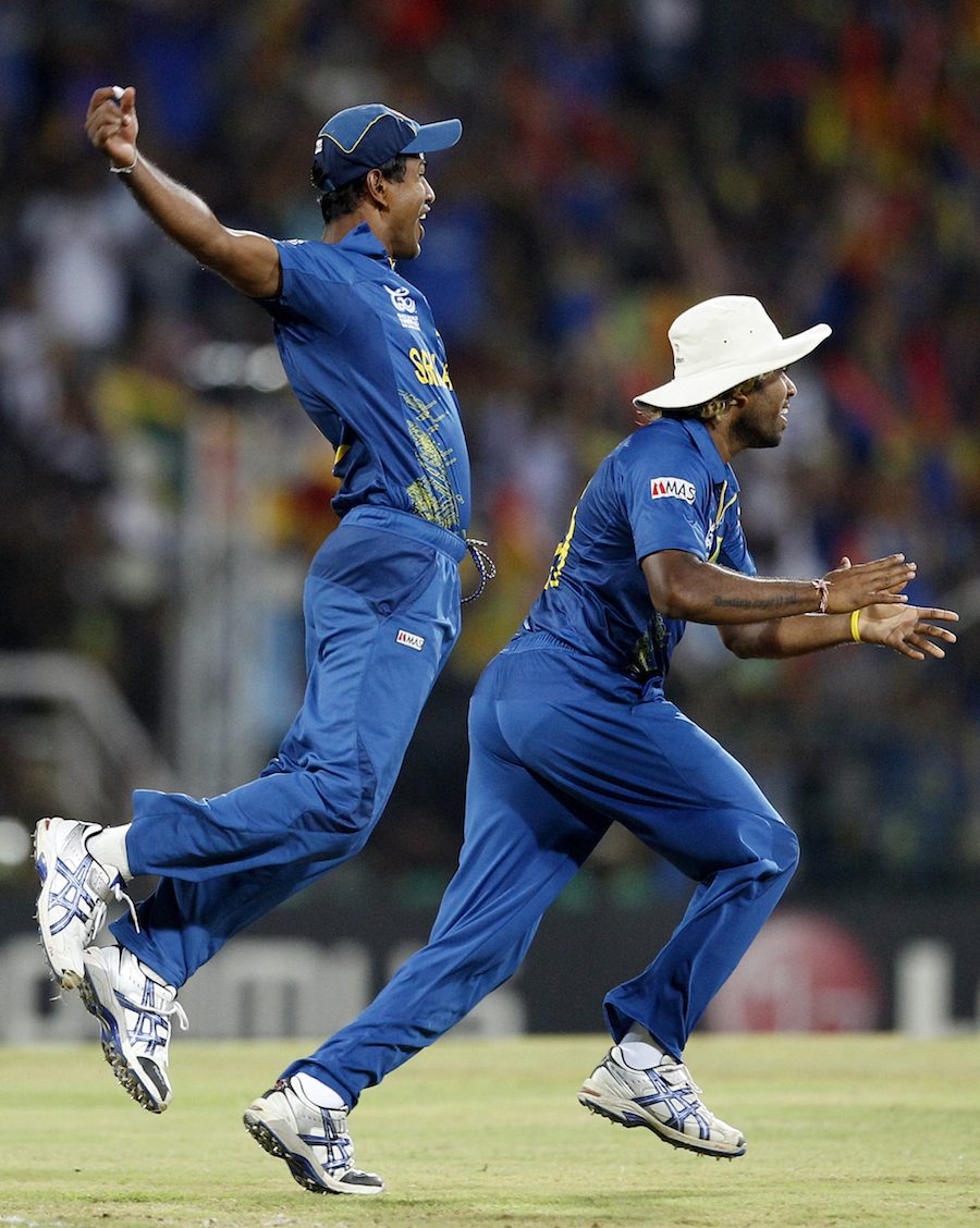 Sri Lanka's Nuwan Kulasekara, left, and Lasith Malinga celebrate the dismissal of West Indies' batsman Johnson Charles