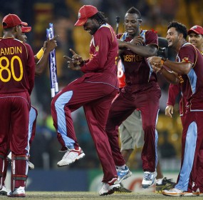 West Indies' cricketer Chris Gayle, center, dances with teammates to celebrate their win over Australia West Indies' cricketer Chris Gayle, center, dances with teammates to celebrate their win over Australia