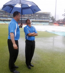 Umpires Adrian Holdstock and Shaun George take stock of the ground at Durban, South Africa v Pakistan