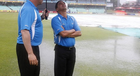 Umpires Adrian Holdstock and Shaun George take stock of the ground at Durban, South Africa v Pakistan