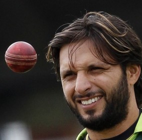 Pakistan's captain Afridi eyes a ball during a training session before their first cricket test match against Australia at Lord's cricket ground in London