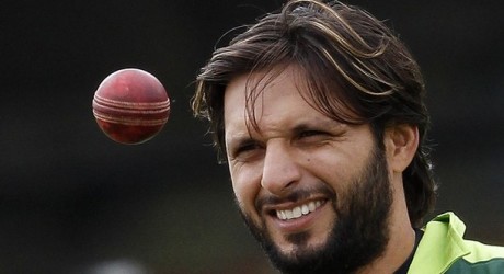 Pakistan's captain Afridi eyes a ball during a training session before their first cricket test match against Australia at Lord's cricket ground in London
